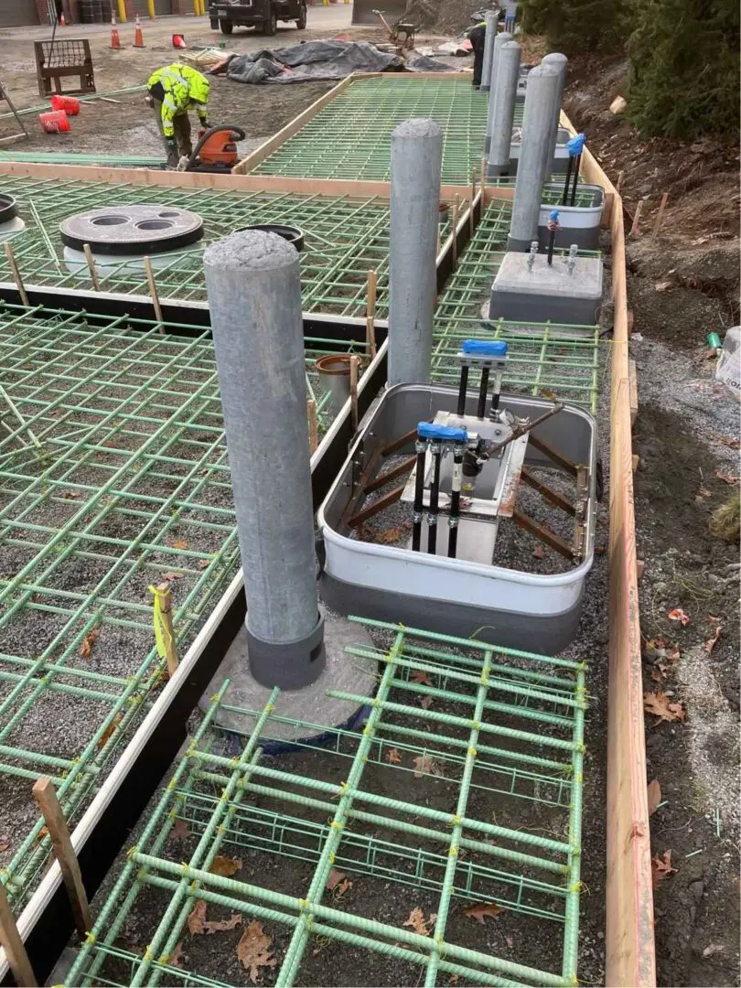 A concrete slab being poured for the construction of a house.